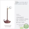 Candle, golden table lamp contains rose