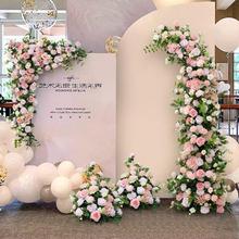 粉色婚礼花艺酒店留影迎宾布置花卉商业活动舞台拱门三角仿真花排