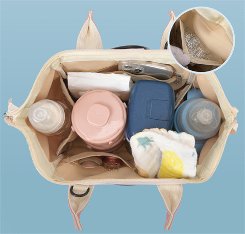 The Mommy bag is small and cute. It has a detachable front pocket and is a multi-functional baby bag. It is waterproof, lightweight, and has a crossbody design. It can be used to carry milk bags undefined