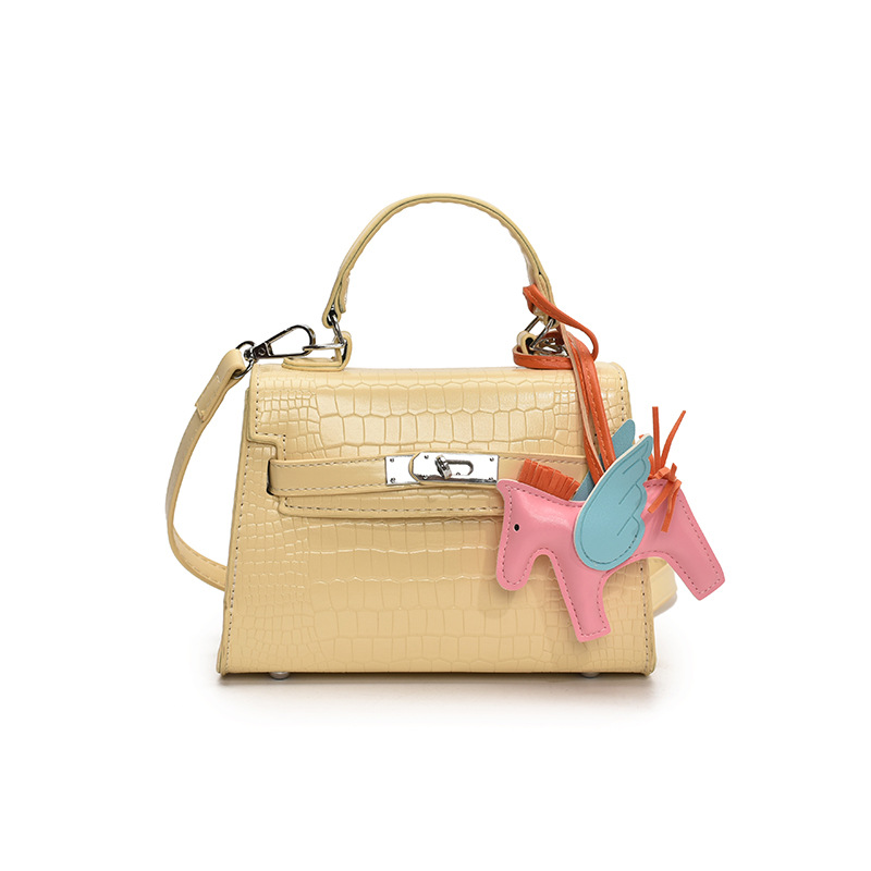 Bolso Kelly de mano de alta gama para mujer 2025 nueva moda casual bolso de hombro con patrón de piedra moda bolso de mensajero de color sólido