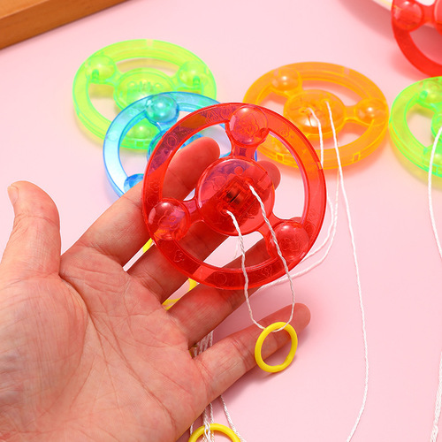 Pull string flywheel Pull string flash flywheel Flash top Luminous flying saucer Fitness children's luminous toys wholesale