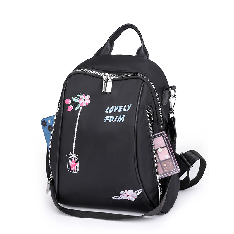 2024 nueva mochila de nailon para mujer, bordado de moda, mochila de viaje de cercanías al aire libre, mochila multifuncional al por mayor