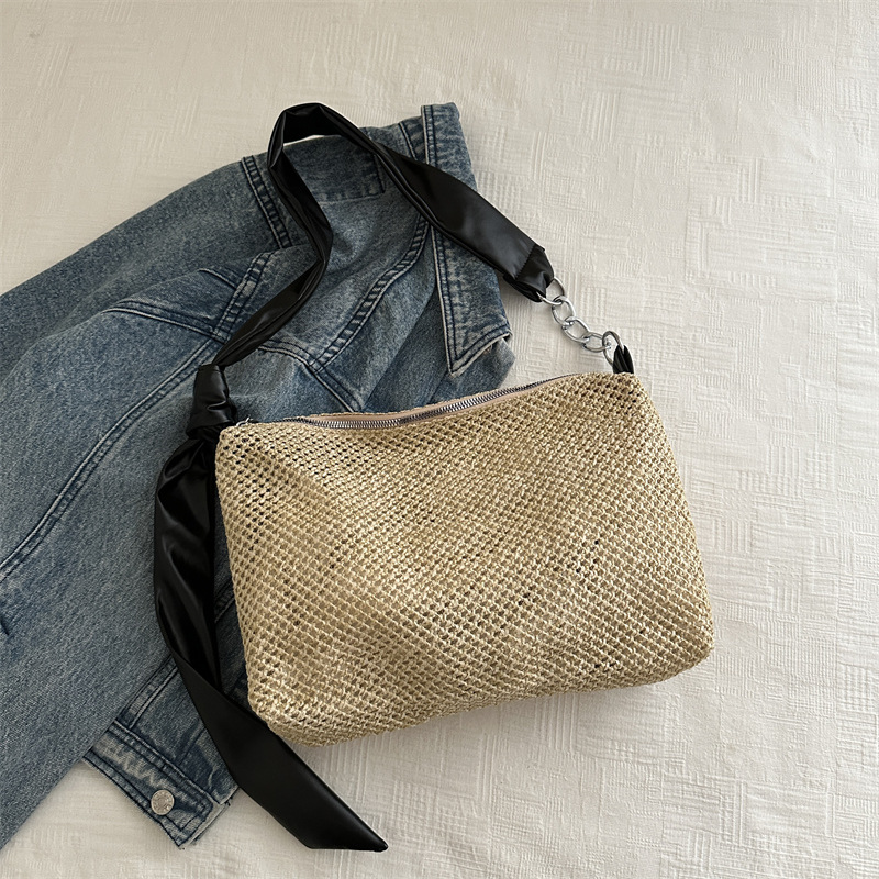 Bolsa de paja de moda coreana de gran capacidad para mujeres este año popular nicho diseño de banda ancha tejida de hombro bolsa de hombro