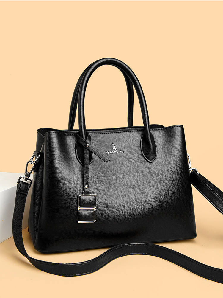 Nuevo bolso de mujer simple de moda, bolso de mano de cuero suave de gran capacidad, bolso de tela de mujer, bolso de canguro