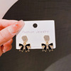 Black earrings with bow, advanced silver needle, simple and elegant design, silver 925 sample, light luxury style, bright catchy style, high-quality style