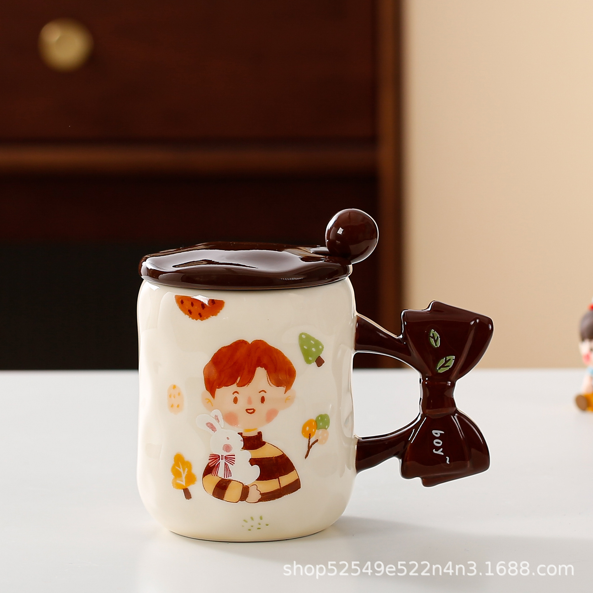 Arco de dibujos animados transfronterizos mango taza de cerámica taza de agua de alto valor taza de regalo con taza de café cuchara cubierta