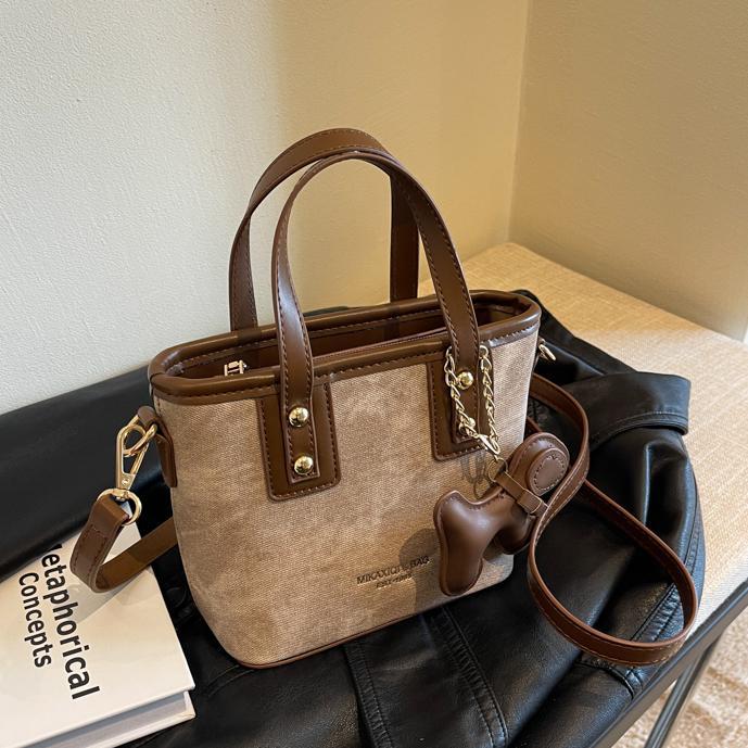 Mochila de alta textura de marea 2024 nuevo estilo versátil retro mochila de hombro de moda portátil bolso de cubo mujer