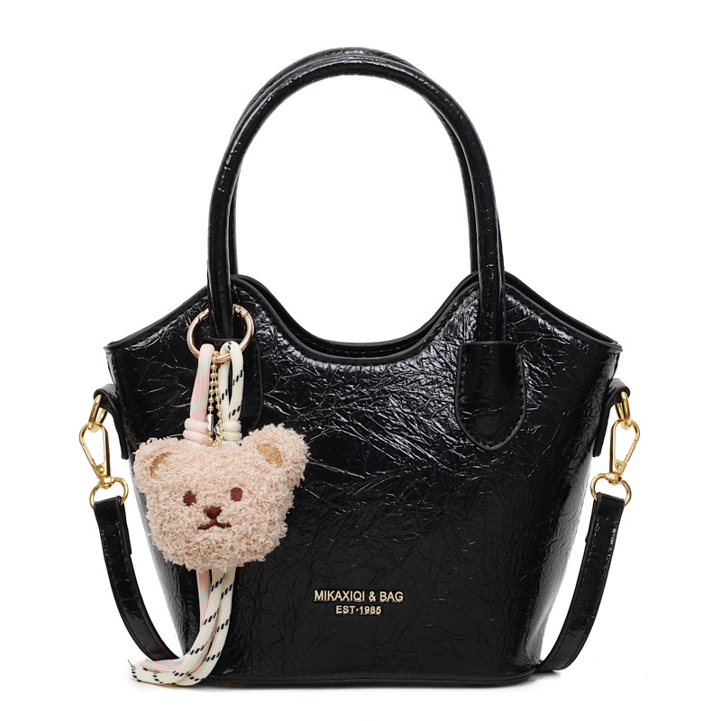 Versión coreana del bolso de cubo de mano casual simple para mujer 2025 nuevo bolso de hombro de viajero de todo fósforo bolso de mensajero de tendencia de moda