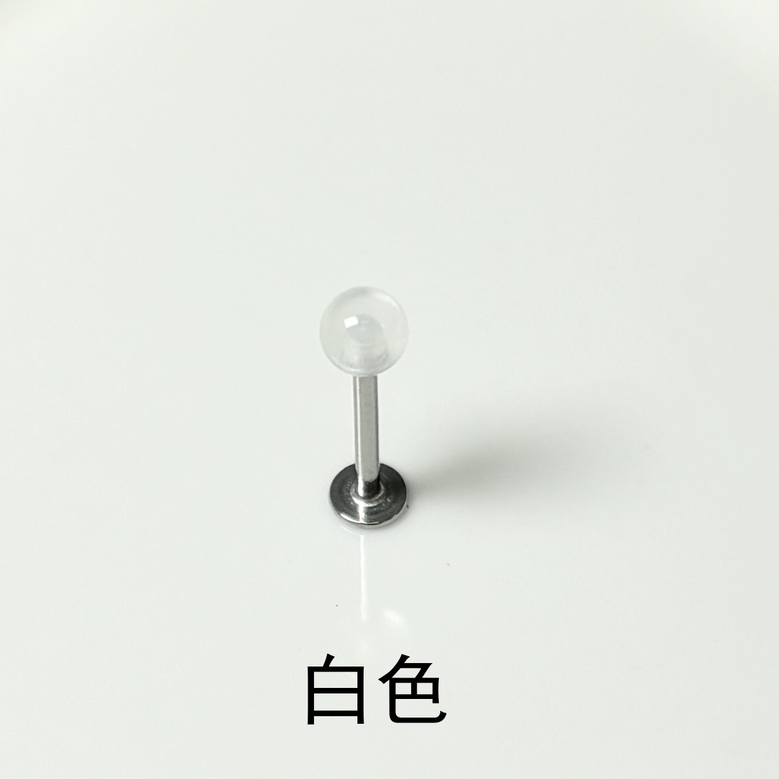 Silver pointed spike labret stud material detail