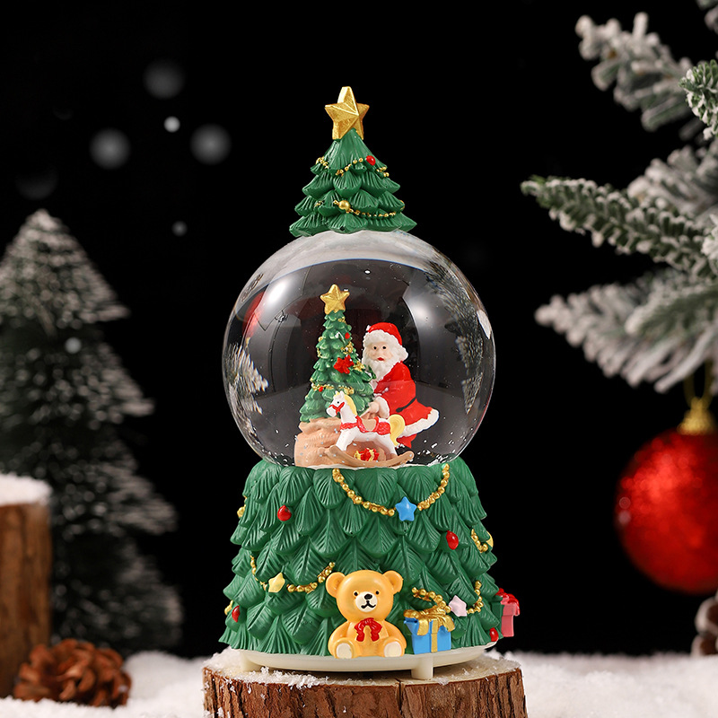 Una variedad de regalos de decoración de Navidad Navidad iluminante bola de cristal caja de música ventana diseño de velas lámparas de viento árbol de Navidad