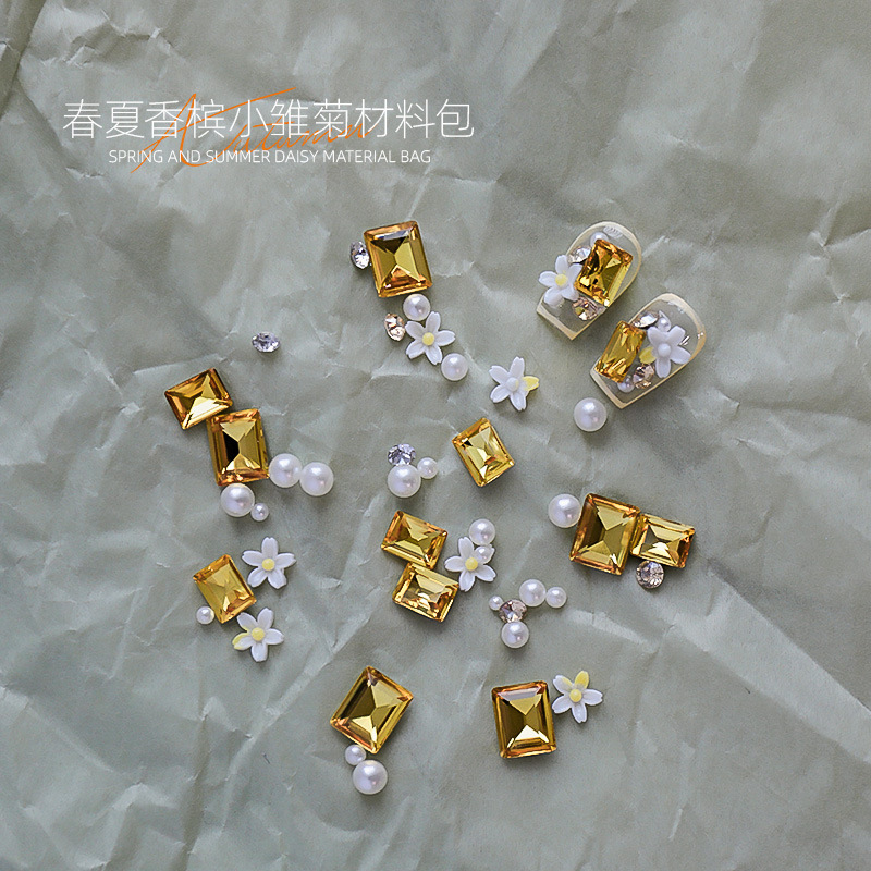 Manicura nueva primavera y verano hierba verde diamante verde margarita pequeña pila diamante perla verde puntiagudo diamante perla combinación de material de perla al por mayor