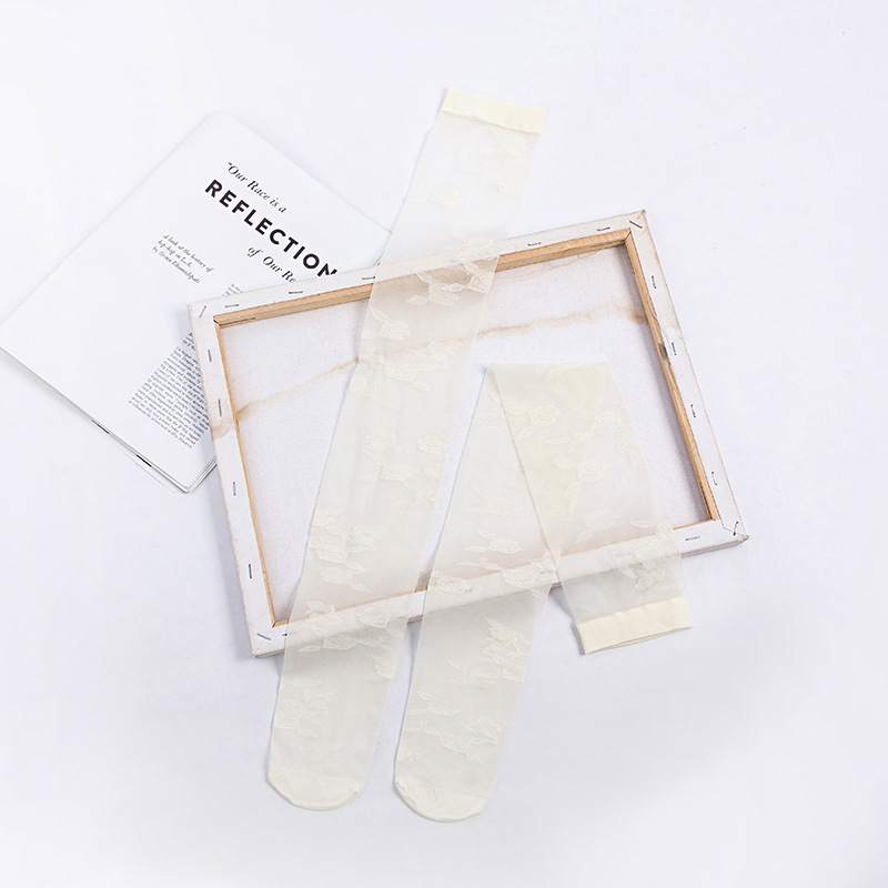 Calcetines por encima de la rodilla de las mujeres ins medias de flores grandes delgadas transparentes estilo JK medias blancas y negras atractivas del color sólido al por mayor