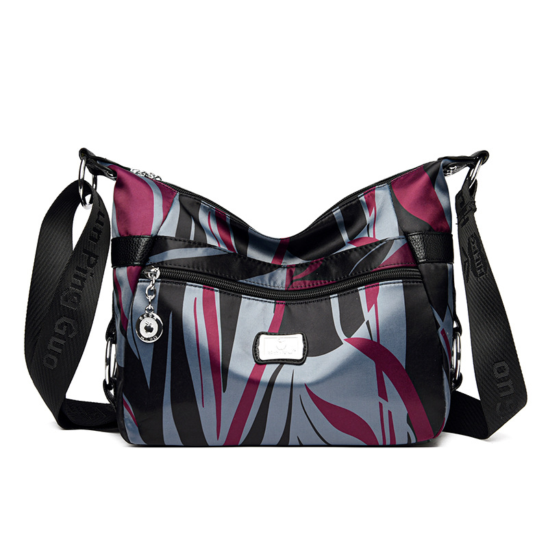 Bolsa de mujer 2023 nueva bolsa de mensajero de hombro de tela Oxford impermeable bolsa de Madre de mujer de mediana edad de gran capacidad multicompartimento