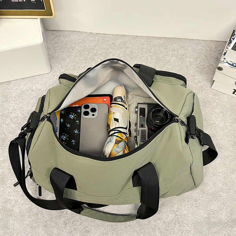 Bolsa deportiva de acondicionamiento físico de gran capacidad para mujeres bolsas de viaje corto bolsas de mano 2025 nuevas bolsas domésticas almacenables