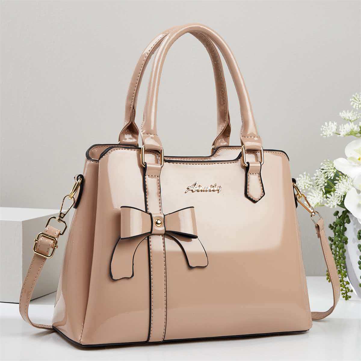 Bolso de mano de arco de piel brillante, bolso de hombro casual de moda, bolso de madre, temperamento, bolso de mochila transfronterizo