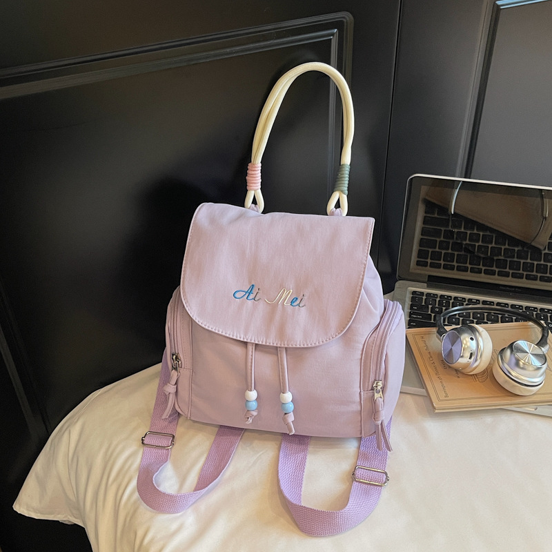 Los estudiantes de tendencia en clase nicho mochila de hombro mujer estilo exterior sensación de diseño de color sólido sensación de moda mochila universal image 8