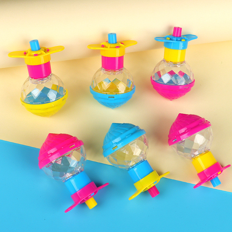 Flashing rotating spinning top
