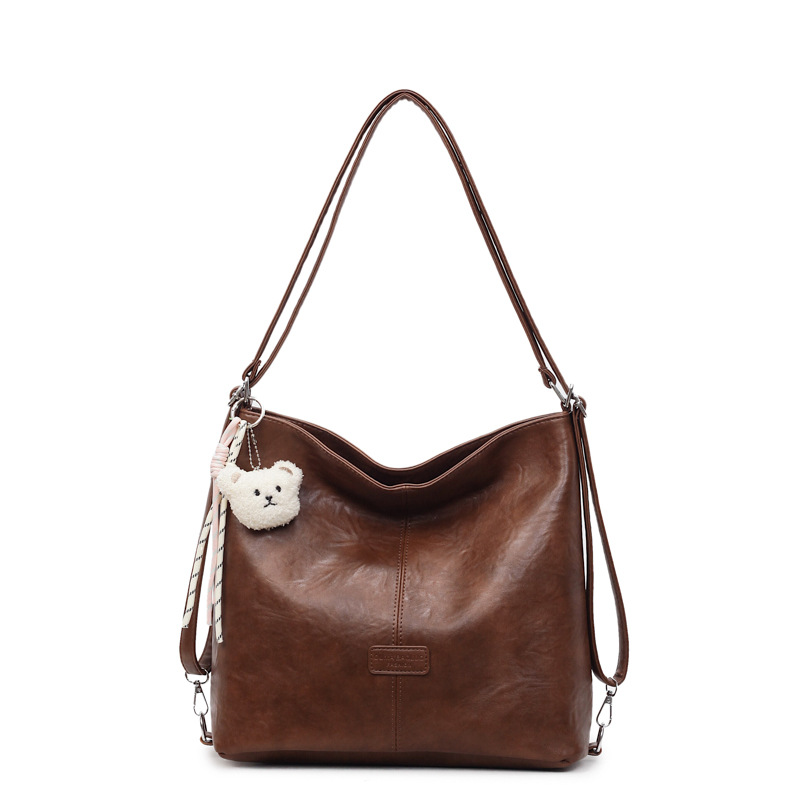 Bolsa de hombro retro transfronteriza de cuero suave de gran capacidad bolsa de cubo de agua para mujeres 2025 nueva simple mochila de viaje ocio