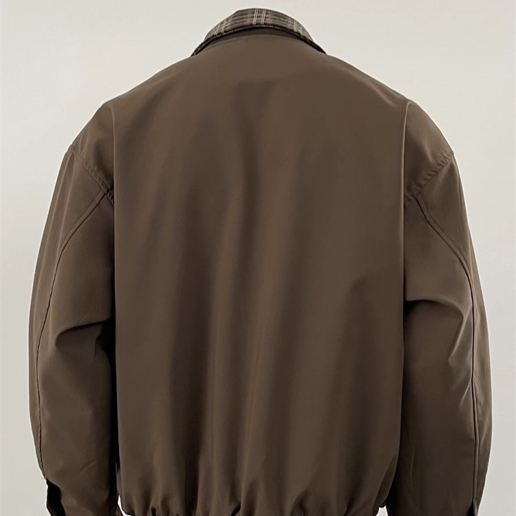 Chaqueta de diseño de nicho de otoño de pareja de contraste de dos piezas falsas de la marca de moda de la calle 2025 nuevo estilo americano