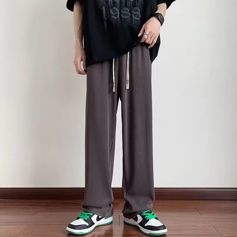 Verano delgado hombre 2026 nueva tendencia confortable pull-out pantalones largos de piernas largas pantalones de chicos rectos sueltos