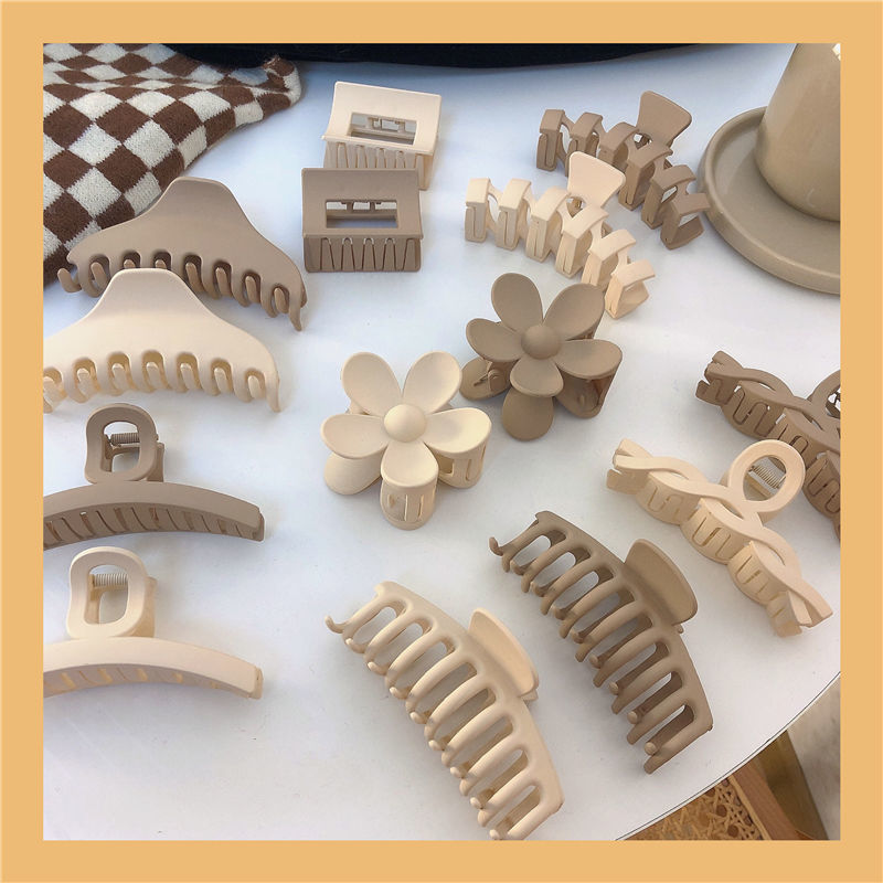 Primavera nuevo todo partido cruz hueco agarre del pelo leche té marrón serie elegante pinza de pelo horquilla simple accesorios para el cabello