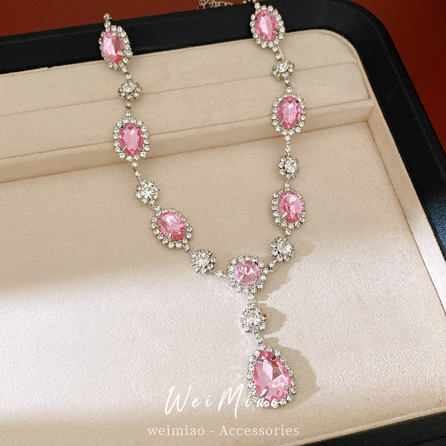 Collar de pendientes de gota de agua elíptica rosa ligero de lujo nicho cadena de clavícula temperamento delicado conjunto de joyas al por mayor