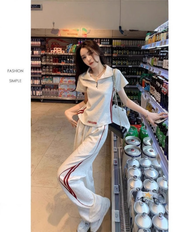 女性のためのファッショナブルなスーツ夏の新しい韓国スタイルの西洋スタイルの年齢を減らすポロカラートップカジュアルスポーツワイドレッグパンツ 2 点セット|undefined