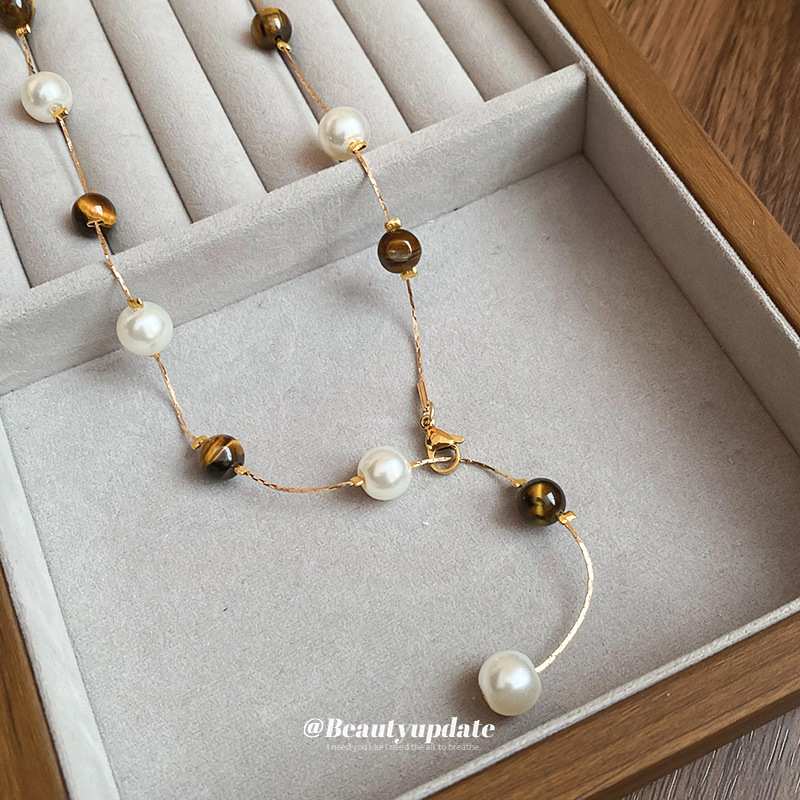 Collar de perlas de piedra de ojo de tigre artificial transfronterizo otoño e invierno cadena de suéter de todo fósforo de nicho accesorios de joyería de moda de alta gama