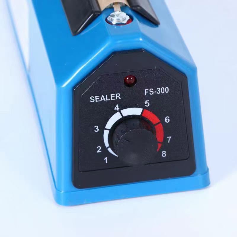 Máquina de sellado de alimentos pequeña comercial manual PFS Mooncake Bolsa de té de plástico Máquina de sellado de presión manual para el hogar 300