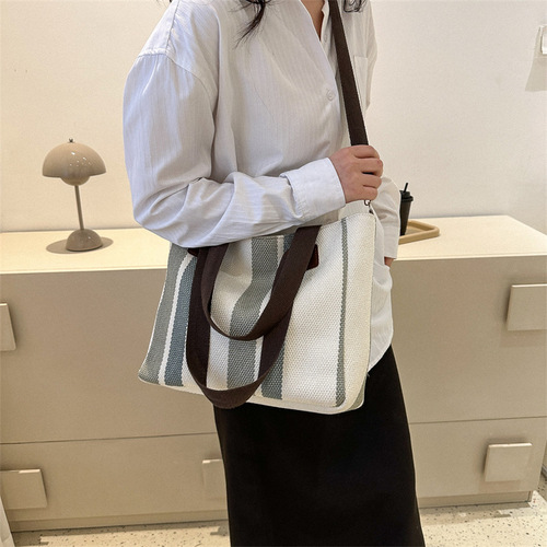 Trendy large-capacity striped canvas bag for women  new fashion commuter handheld tote bag single shoulder crossbody bag