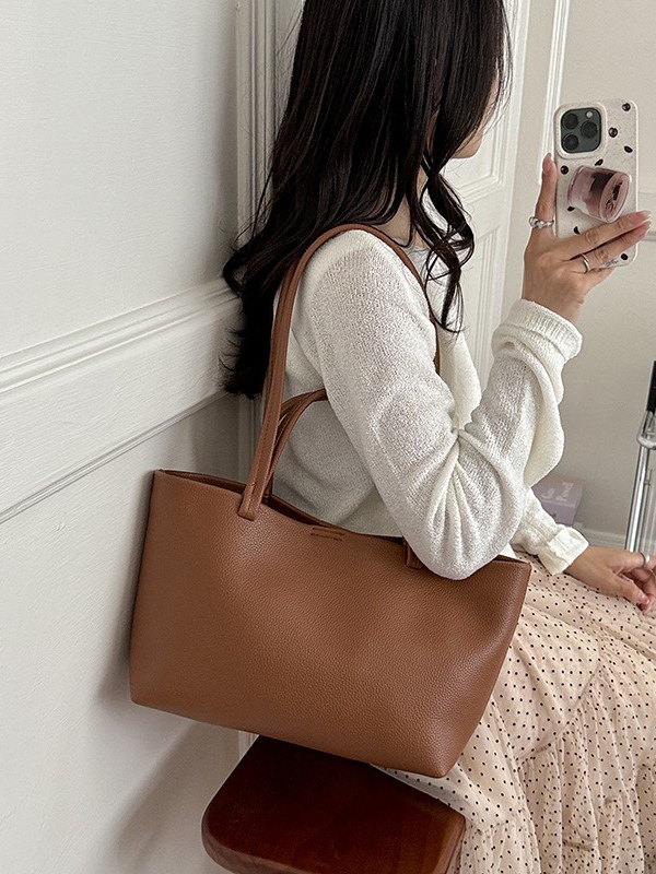 Bolso para mujeres 2026 nueva moda simple mochila de hombro casual textura alta lujosa bolsa de trabajo diaria