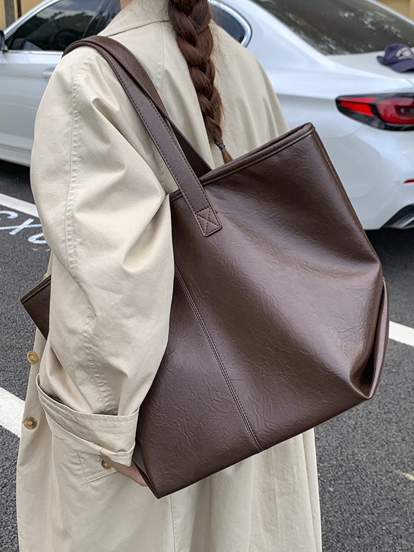 Bolsa de moda retro de gran capacidad para mujeres 2025 nueva simple versátil alta sensación de mochila de viaje diario