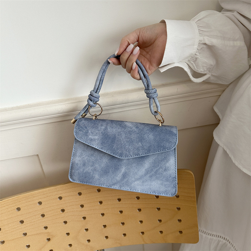Bolso público pequeño para mujeres 2026 nuevo bolso cuadrado de alta calidad sensación de diseño retro bolso de hombro simple bolso de mano