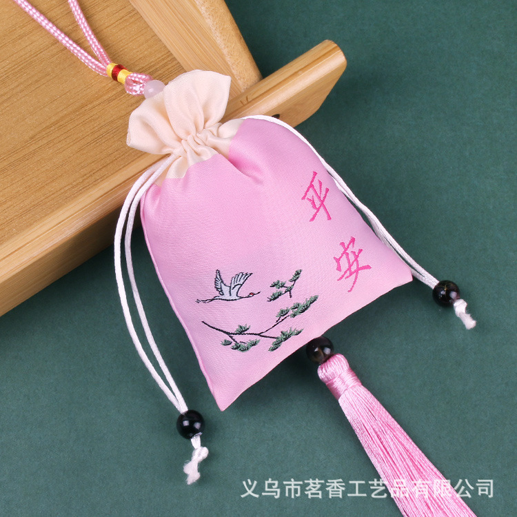 Fuchsia protective amulet with tassels
