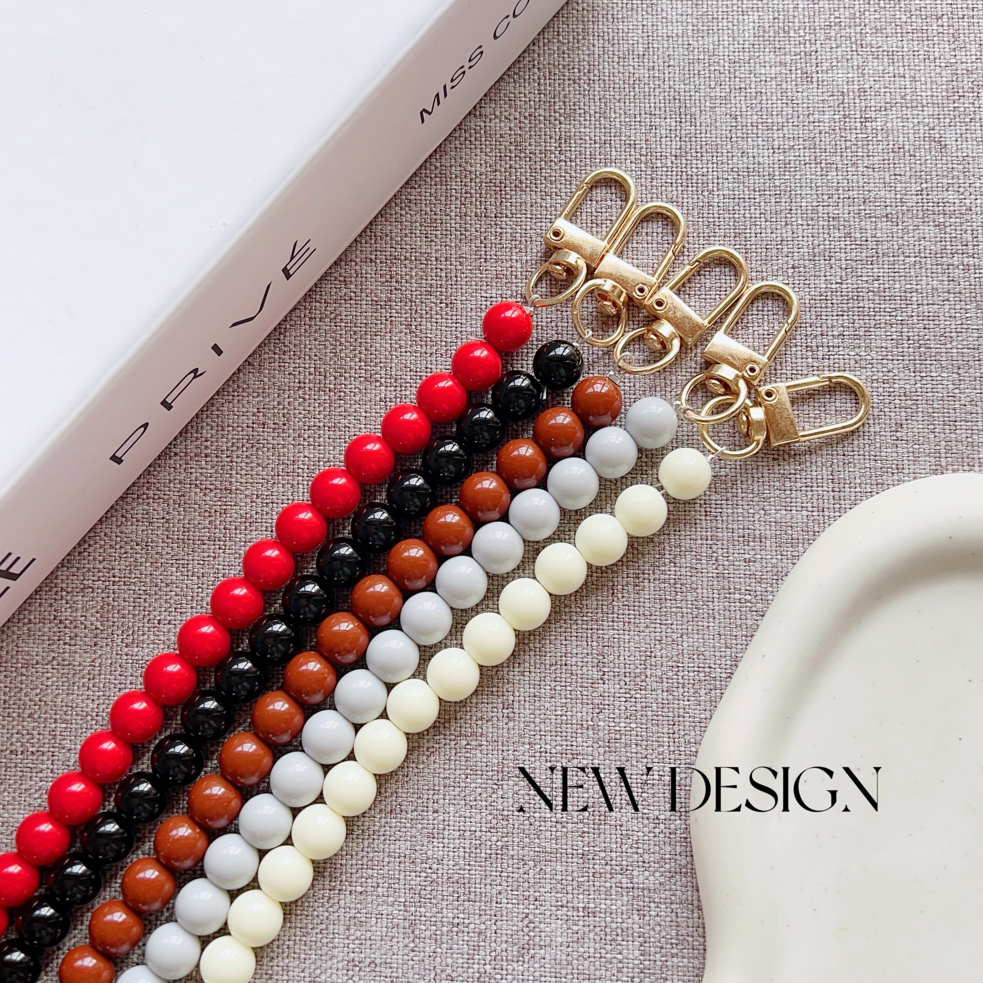 Nuevo estilo japonés y coreano cadena de cuentas de color sólido pulsera corta llavero bolsa de accesorios de cadena de perlas de todo fósforo cordón transfronterizo