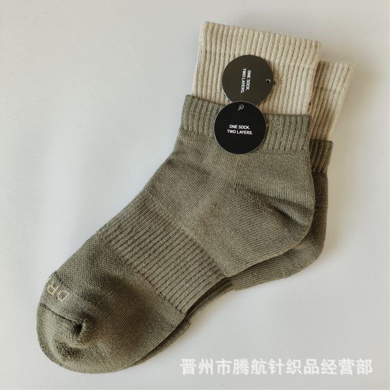 蘇万ナイキの靴下のカラーの二重は男女の中で長い筒のタオルの底のスポーツの靴下をつなぎ合わせてバスケットボールの靴下を走ります。