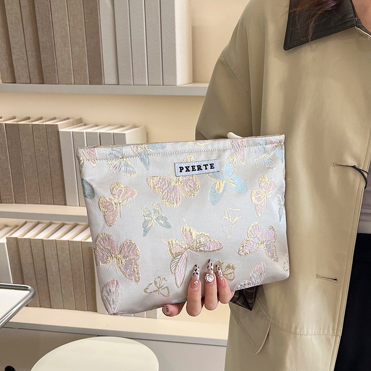 Bolsa de maquillaje de mariposa transfronteriza pequeña bolsa fresca portátil de cuidado de la piel bolsa de almacenamiento bolsa de lavado de viaje bolsa de lona bolsa de mano