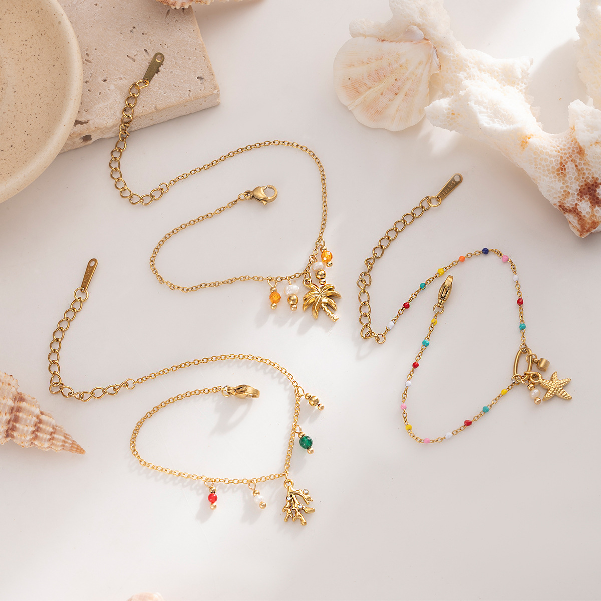 Tena Pulsera de acero inoxidable europea y americana Sensación simple y de alto nivel Estilo de playa Coconut Estrella de mar Pulsera de aceite de gota Lujo ligero Chica de nicho