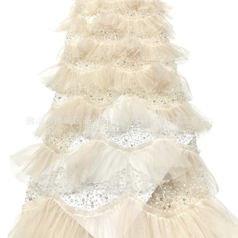 Falda de pastel laminada hecha a mano hilo de malla de perlas ligero lujoso vestido de aire de hadas de estilo de moda alta tela de vestido