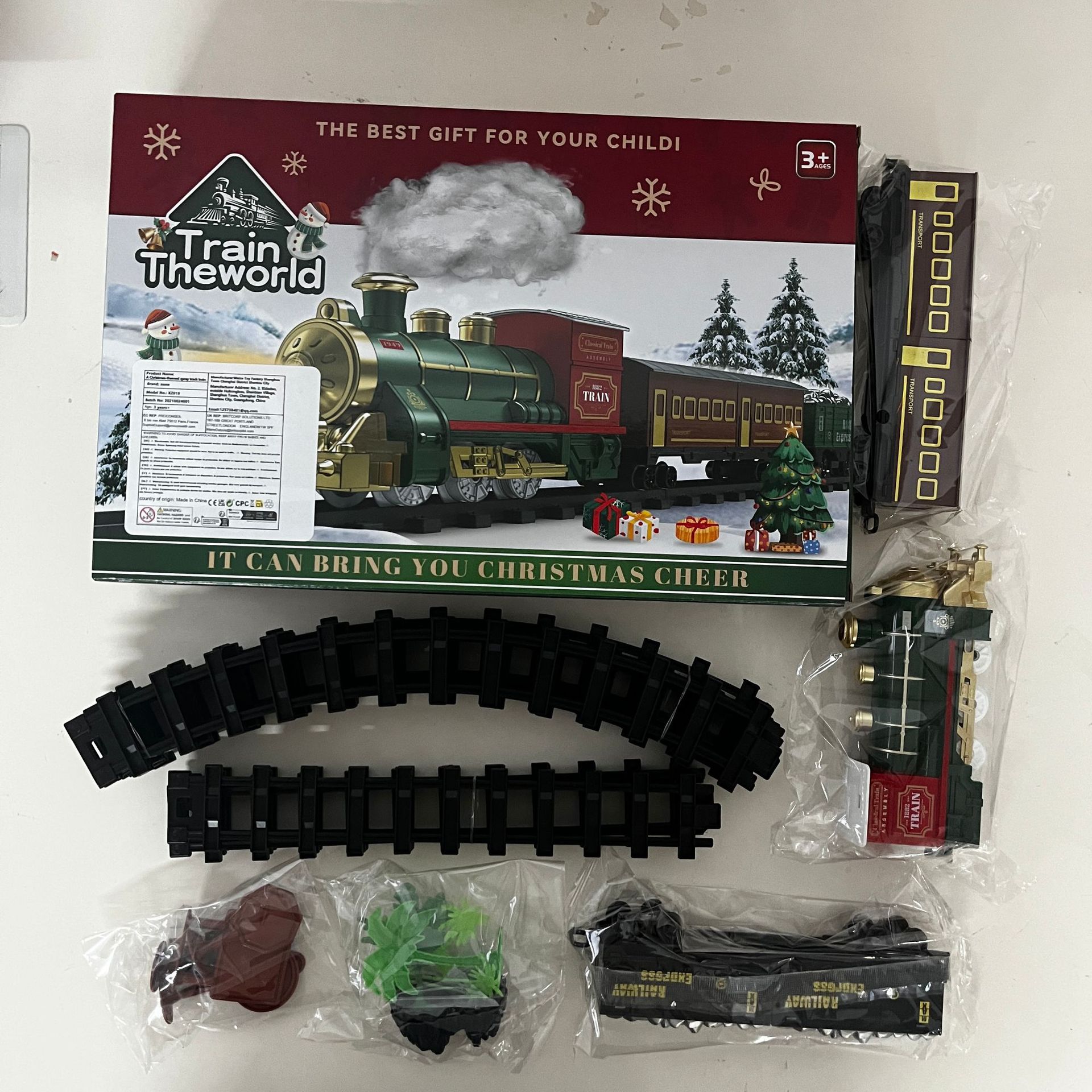 Venta rápida transfronteriza explosiva juguetes de pista de Navidad eléctricos clásicos vapor spray tren tren de música vagón