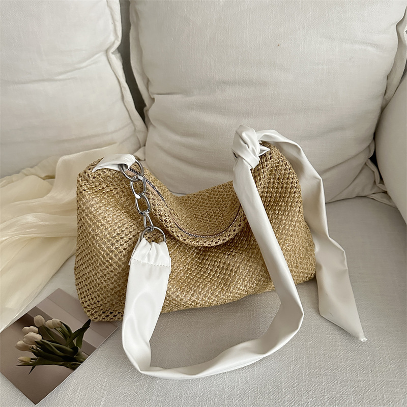 Bolsa de paja de moda coreana de gran capacidad para mujeres este año popular nicho diseño de banda ancha tejida de hombro bolsa de hombro