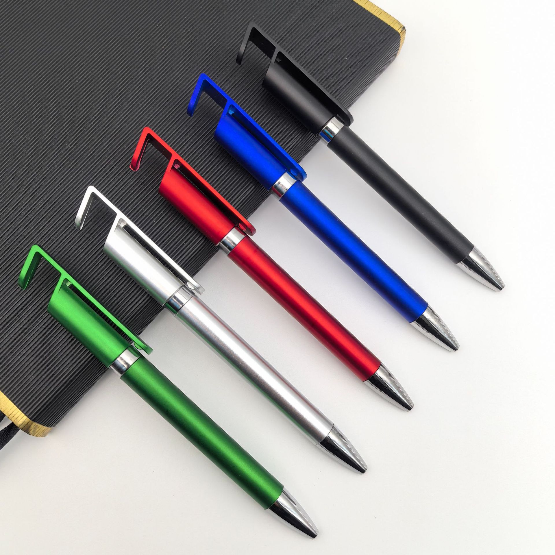 Bolígrafo de soporte para teléfono móvil multifunción Bolígrafo de regalo al por mayor Bolígrafo de plástico retorcido personalizado Bolígrafo publicitario de soporte para teléfono móvil