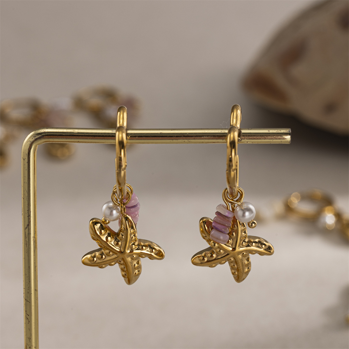 Taena Cross-border Ocean Fashion Orejas de todo fósforo Pendientes de estrella de mar de acero inoxidable de oro de 18K Pendientes de diseño retro