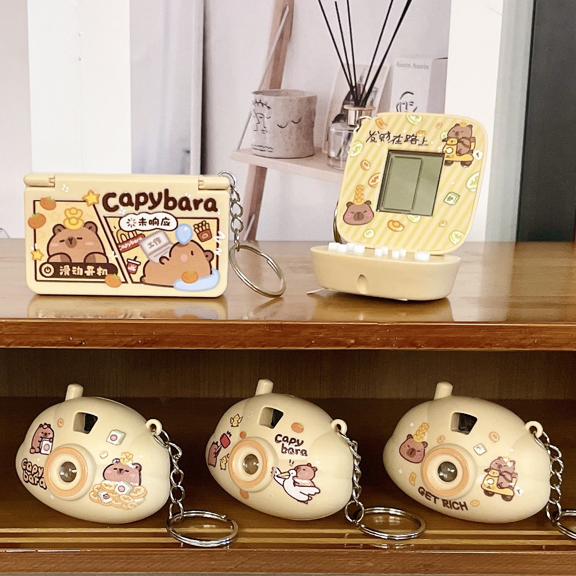 Juegos portátiles creativos de descompresión delfines de agua cámara de proyección llavero tapa de flip bolso de computadora de juegos de computadora colgante