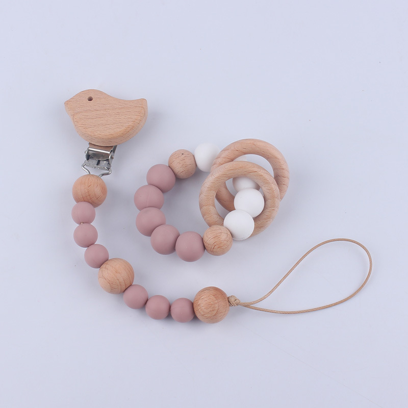 Nuevo Bebé y niño suministros de dibujos animados clip de haya calmante bebé chupete cadena mordedor pulsera de juguete conjunto de dos piezas