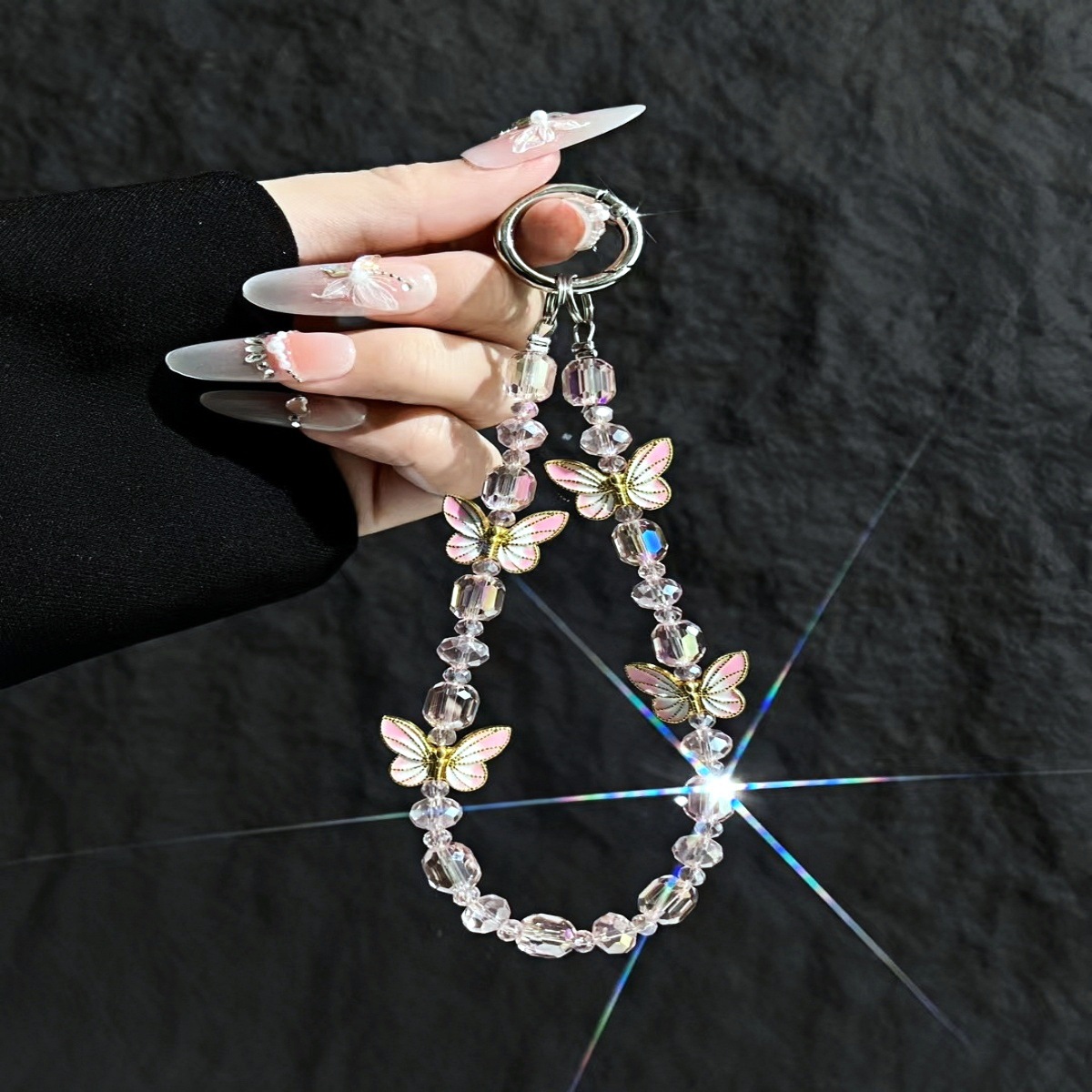 Cadena de teléfono móvil al por mayor cadena de cuentas de cristal flor de mariposa sentido de alta gama cadena corta hecha a mano para mujer bolsa de viento NIS todo fósforo