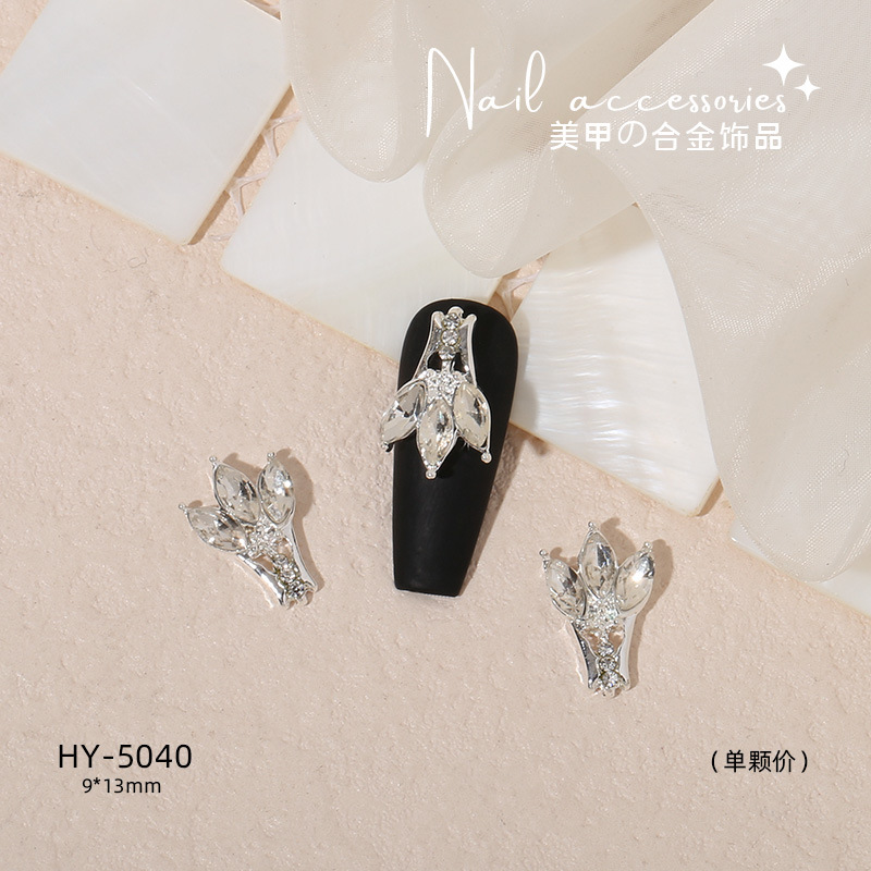 Nuevo arco de uñas amor aleación decoración de uñas flor de la luna mariposa clavo taladro fábrica joyería al por mayor