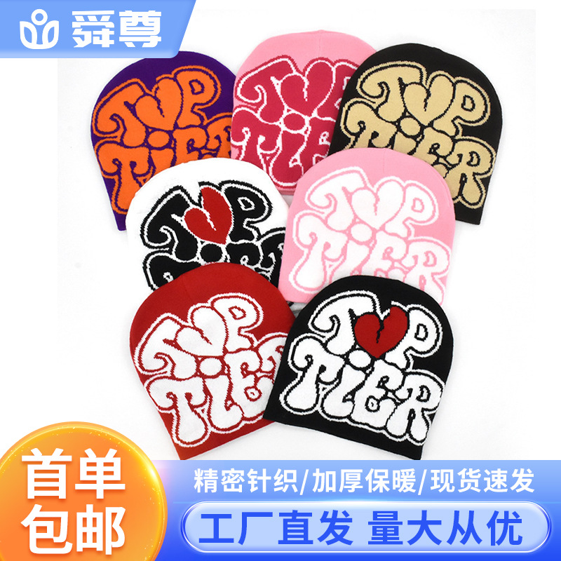 Sombreros de guisantes transfronterizos en stock de suministro directo de fábrica, gorro de lana de punto jacquard de letras de moda de venta caliente en Europa y América