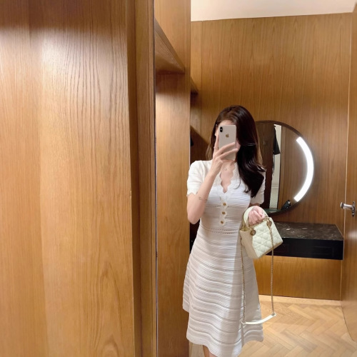 Elegant Sheath Hollowed-Out Ice Silk Dress for 2025 Summer: Wavy V-Neck, Slimming, and Body-Sculpting Knitted Skirt for Women
