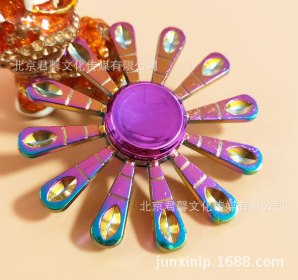 B Dedos de araña de colores, peonza, yema del dedo de metal de tres hojas, peonza de dos hojas, productos pequeños, suministro al por mayor